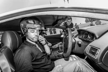 Johannesburg, South Africa - October 05 2013: Jay Kay of Jamiroquai driving an Aston Martin on Kyalami Race Trackのeditorial素材