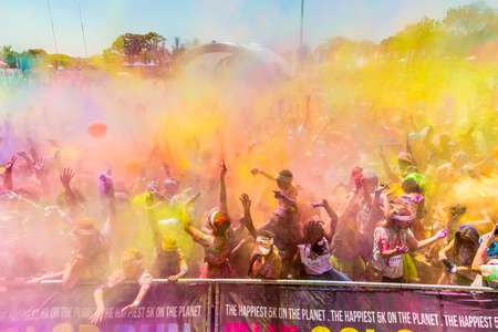 Johanneburg, South Africa,  09/25/2016, Young people having fun at The Color Run 5km Marathon, Bright color paint all over a large crowdのeditorial素材