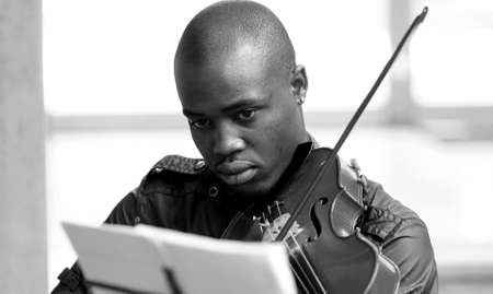 Johannesburg, South Africa - August 28 2010: Diverse youth at music school orchestra