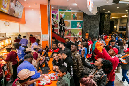Johannesburg, South Africa - July 13 2017: Customers at a Popeyes Take Out Fast Food Restaurant
