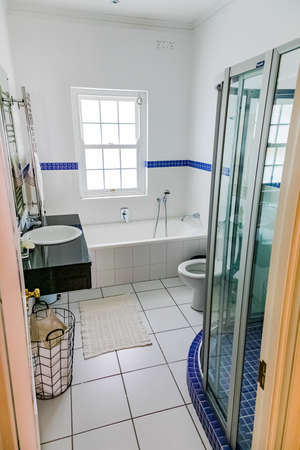 Cape Town, South Africa - February 6, 2020: Inside interior of empty bathroom and toilet in...