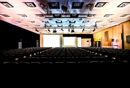 Rows of empty chairs in large Conference hall for Corporate Convention or Lecture