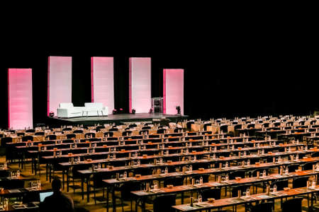 Rows of empty chairs in large Conference hall for Corporate Convention or Lectureの写真素材
