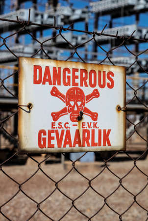 Danger sign on a fenceの写真素材