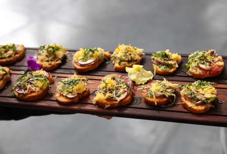 Cheese and Crackers on a wooden tray at corporate gala event