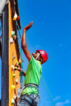 Johannesburg, South Africa - June 8, 2012: African person having fun on a outdoor climbing wallのeditorial素材