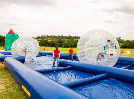 Johannesburg, South Africa - November 25, 2012: Inflatable water slides and other activities at outdoor kids fun parkのeditorial素材