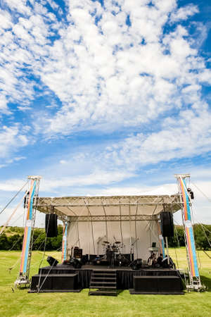 Johannesburg, South Africa - November 25, 2012: Small outdoor concert venue stage and lighting in a empty fieldのeditorial素材