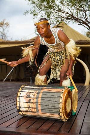 Johannesburg, South Africa - September 15, 2012: African Men playing traditional drums for touristsのeditorial素材