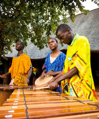 Johannesburg, South Africa - December 9, 2012: African Men playing traditional drums for touristsのeditorial素材