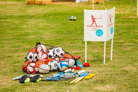 Johannesburg, South Africa - November 25, 2012: Bat and Ball sport items on the grass field parkのeditorial素材