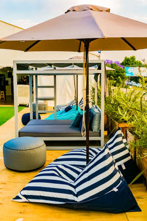 Johannesburg, South Africa - October 11 2018: Outdoor beer garden cocktail lounge with comfy couches
