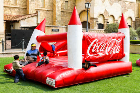 Johannesburg, South Africa - September 22, 2012: Diverse children having fun on a jumping castle at...