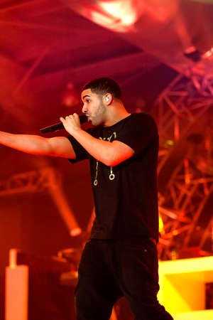 Johannesburg, South Africa - December 09, 2011: Singer Songwriter Drake live in concert on stage with backing bandのeditorial素材