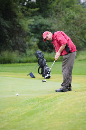 Johannesburg, South Africa - November 19, 2009: Amateur golfers playing a round of golf as a recreational pursuit on a rainy dayのeditorial素材