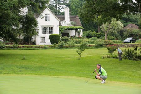 Johannesburg, South Africa - November 19, 2009: Amateur golfers playing a round of golf as a recreational pursuit on a rainy dayのeditorial素材