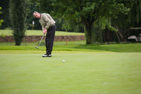 Johannesburg, South Africa - November 19, 2009: Amateur golfers playing a round of golf as a recreational pursuit on a rainy dayのeditorial素材