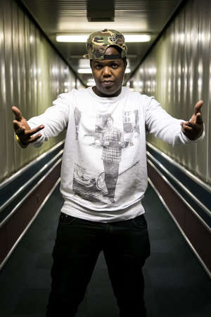 Johannesburg, South Africa - February 17, 2014: African artist AY from  Tanzania posing for a photo