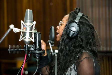 Johannesburg, South Africa - February 17, 2014: African Artist Dama Do Bling, Mozambique singing in a SABC recording studioのeditorial素材
