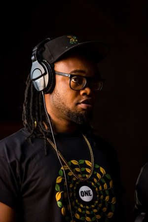 Johannesburg, South Africa - February 18, 2014: African Artist Dontom, Nigeria singing in a SABC recording studioのeditorial素材