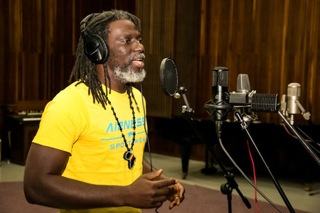 Johannesburg, South Africa - February 17, 2014: African Artist Tiken Jah Fakoly, Cote d'Ivoire singing in a SABC recording studioのeditorial素材