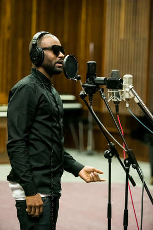 Johannesburg, South Africa - February 17, 2014: African Artist Fally Ipupa, DRC singing in a SABC recording studioのeditorial素材