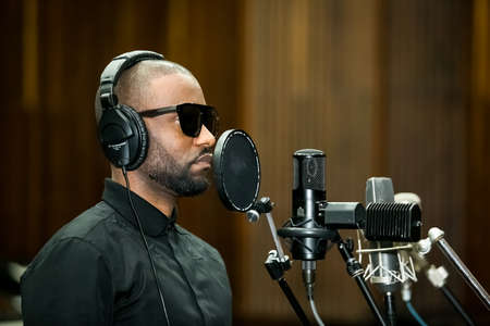 Johannesburg, South Africa - February 17, 2014: African Artist Fally Ipupa, DRC singing in a SABC recording studioのeditorial素材
