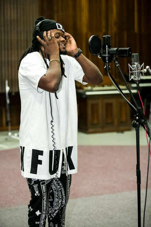 Johannesburg, South Africa - February 17, 2014: African Artist Buffalo Souljah, Zimbabwe singing in a SABC recording studioのeditorial素材