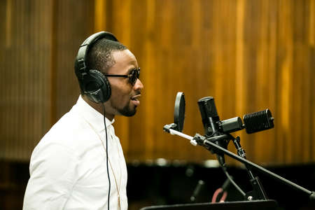 Johannesburg, South Africa - February 18, 2014: African Artist D'banj, Nigeria singing in a SABC recording studioのeditorial素材