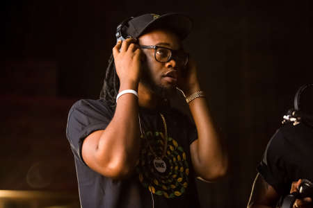 Johannesburg, South Africa - February 18, 2014: African Artist Dontom, Nigeria singing in a SABC recording studioのeditorial素材