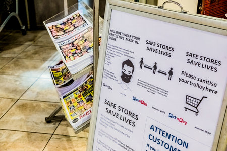 Cape Town, South Africa - December 10, 2020: Information notice board outside Pick n Pay grocery store, with regard to virus related measures to keep us safeのeditorial素材