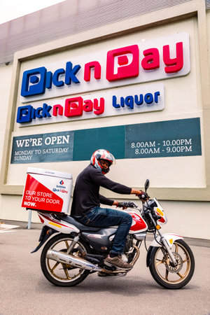 Cape Town, South Africa - December 10, 2020: Express Service home delivery man with bike outside...