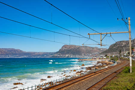 Cape Town, South Africa - March 23, 2021: Passenger rail running through small coastal town of St Jamesのeditorial素材