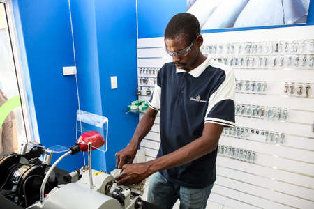 Johannesburg, South Africa - October 2, 2012: Key Cutting service inside a laundromat dry cleaners