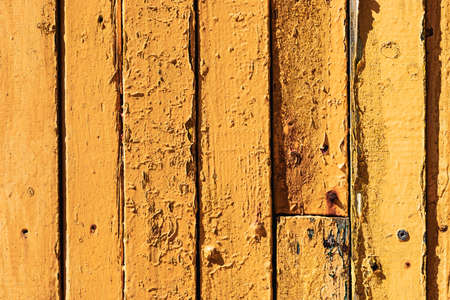 Close Up Macro texture of old faded paint on wooden timber planksの写真素材