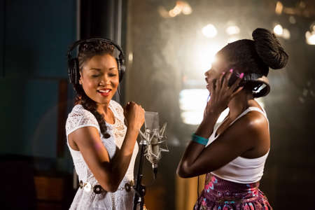 Johannesburg, South Africa - April 29, 2015: Arielle T and Selmor Mtukudzi recording vocal part on Afro-pop song in studioのeditorial素材