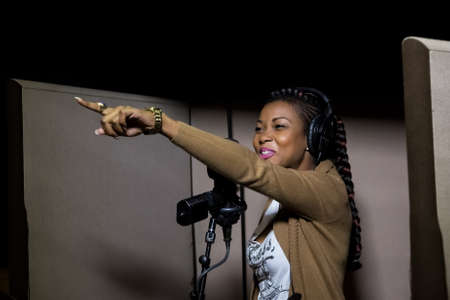 Johannesburg, South Africa - April 28, 2015: Arielle T, Gabon singer recording vocal part on Afro-pop song in studioのeditorial素材