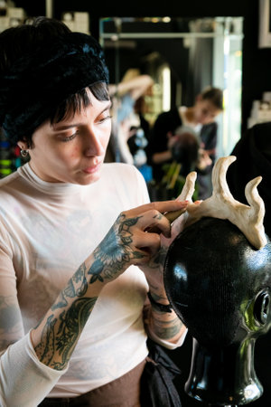 Cape Town, South Africa - April 19, 2021: Team Building workshop for hairdressers making clay sculptures of hair styles on mannequinのeditorial素材