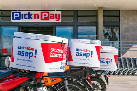 Cape Town, South Africa - September 9, 2021: Express Service delivery bikes parked outside local...