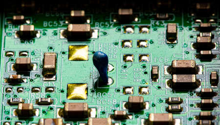 Macro Close up of components and microchips on PC circuit board.