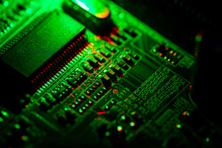 Macro Close up of components and microchips on PC circuit board.