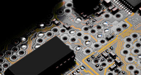 Macro Close up of printed wiring and components on PC circuit board