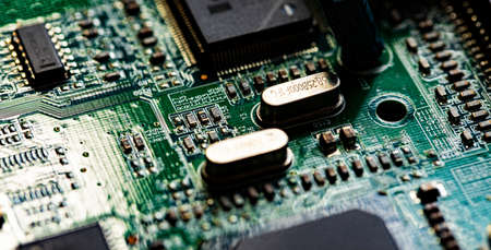 Macro Close up of components and microchips on PC circuit board of modem router