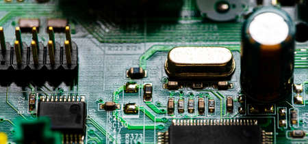 Macro Close up of components and microchips on PC circuit board.