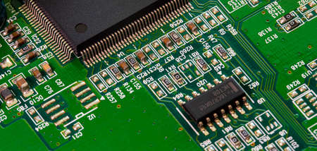 Macro Close up of components and microchips on PC circuit board of modem router