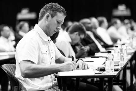 Johannesburg, South Africa - October 22, 2014: Delegates attending a sales convention in large conference hallのeditorial素材