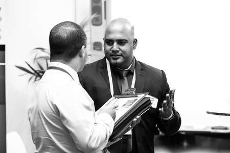 Johannesburg, South Africa - August 20, 2015: Delegates networking at a sales convention in large conference hallのeditorial素材