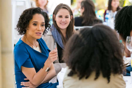 Johannesburg, South Africa - August 18, 2016: Ladies networking at woman's team-building luncheon in garden cafeのeditorial素材