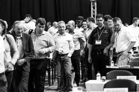 Johannesburg, South Africa - October 22, 2014: Delegates attending a sales convention in large conference hallのeditorial素材
