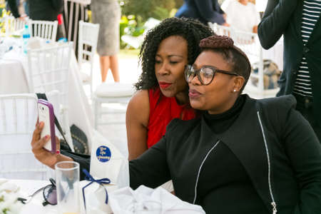 Johannesburg, South Africa - August 18, 2016: Ladies networking at woman's team-building luncheon in garden cafeのeditorial素材